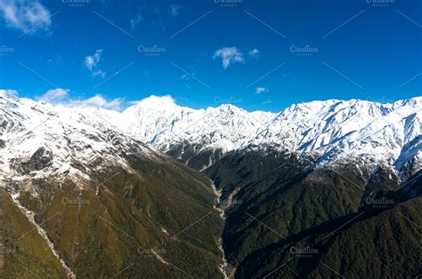 Aerial view of New Zealand mountains with river, wilderness land ...