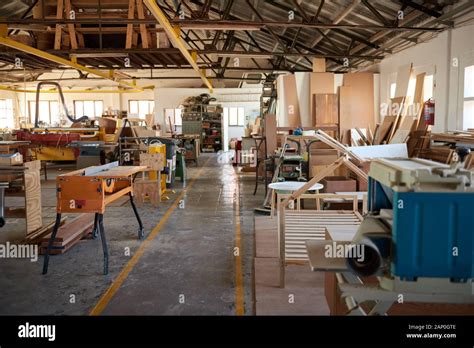 Wood and machinery in a large carpentry workshop Stock Photo - Alamy