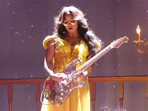 H.E.R. shreds as Belle on a custom Beauty and the Beast guitar