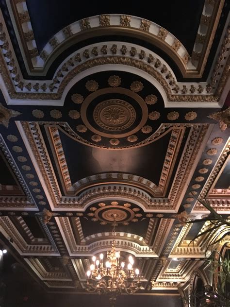 an ornate ceiling with chandeliers and lights