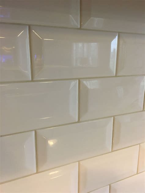 White beveled subway tile with alabaster grout | White beveled subway tile, White tile kitchen ...