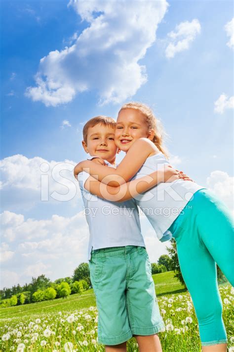 Funny Kids Hugging Together On A Meadow Stock Photo | Royalty-Free | FreeImages