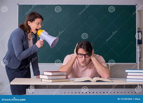 Old Female Teacher and Male Student in the Classroom Stock Photo - Image of discussing, lecturer ...