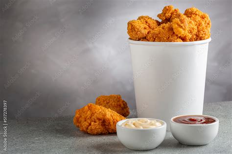 Crispy fried chicken in the bucket. Chicken bucket. Stock Photo | Adobe ...