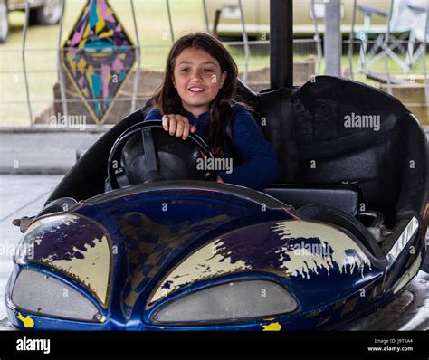 Children enjoying bumper cars at the county fair Stock Photo - Alamy