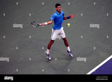 Novak djokovic hitting a forehand hi-res stock photography and images ...