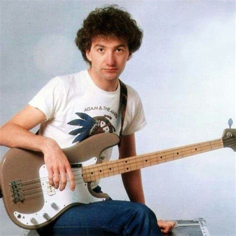 John Deacon sits with bass guitar | John deacon, Deacon, Queen photos