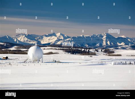 Spherical Oil Tank In A Snow-Covered Field; Longview, Alberta, Canada ...