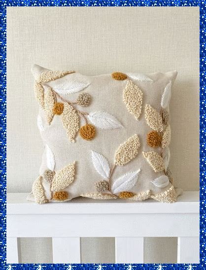 a decorative pillow on top of a white crib