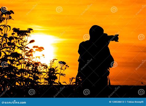 Photographer Silhouette stock image. Image of sunset - 128538613