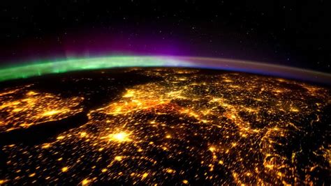 Planet Earth night view with illuminated cities seen from the International Space Station with ...