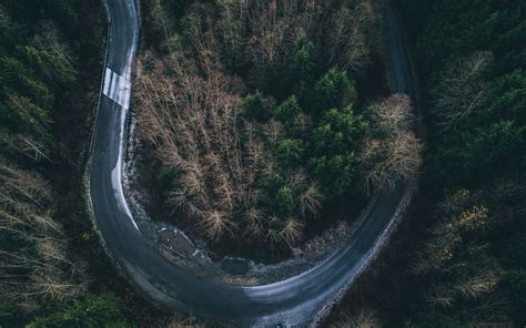 aerial photography of curved road Mac Wallpaper Download | AllMacWallpaper