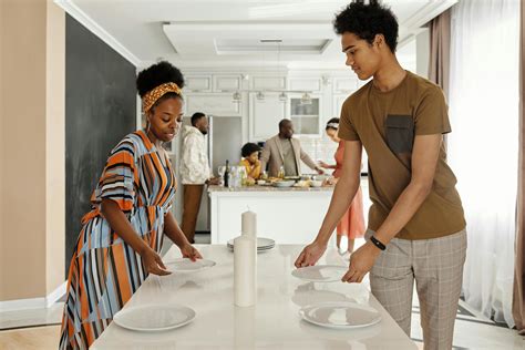 Family Setting the Table for Dinner · Free Stock Photo