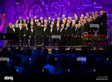 Male voice choir singing on stage in competition at the National ...