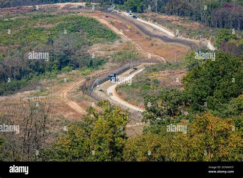 Highly fortified border fence at the Korean DMZ, with watch towers, Paju South Korea Stock Photo ...