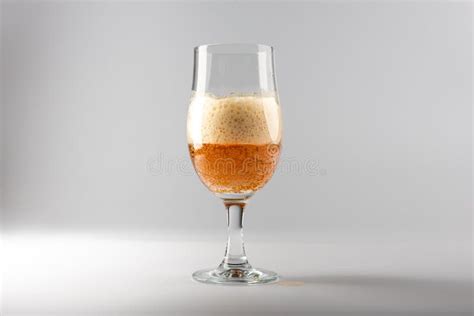 A Half Full Beer Glass with a Large Head Stock Image - Image of brown, freshness: 164849407