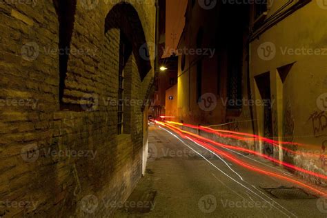 stone medieval street in Bologna at night 12043911 Stock Photo at Vecteezy