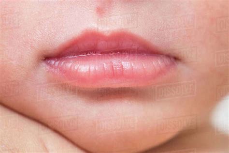 Close Up, Macro of Newborn Baby Lips With Tiny Bubbles - Stock Photo - Dissolve