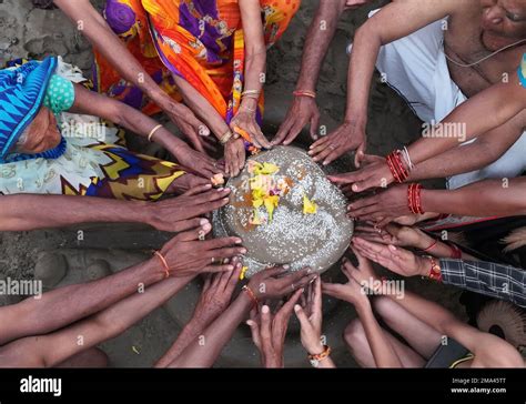 Hindu devotees perform rituals in the Sangam, the confluence of the Rivers Ganges, Yamuna and ...