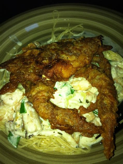 Fried soft shell crab over angel hair pasta topped with shrimp and crab ...