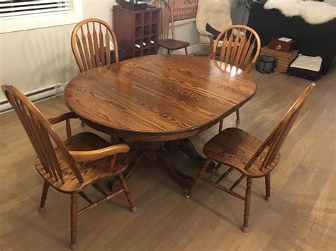 Solid oak dining table with 3 leaves, 2 captain chairs and 6 side chairs Esquimalt & View Royal ...