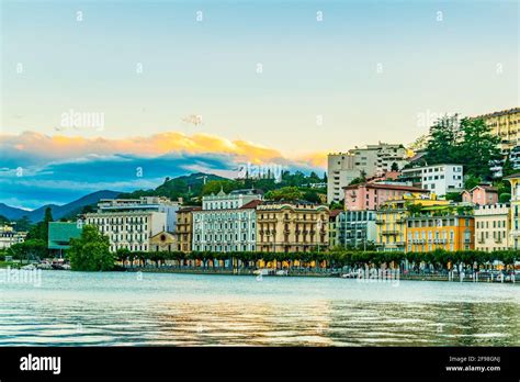 Sunset view of old town of Lugano facing the Lugano lake in Switzerland Stock Photo - Alamy