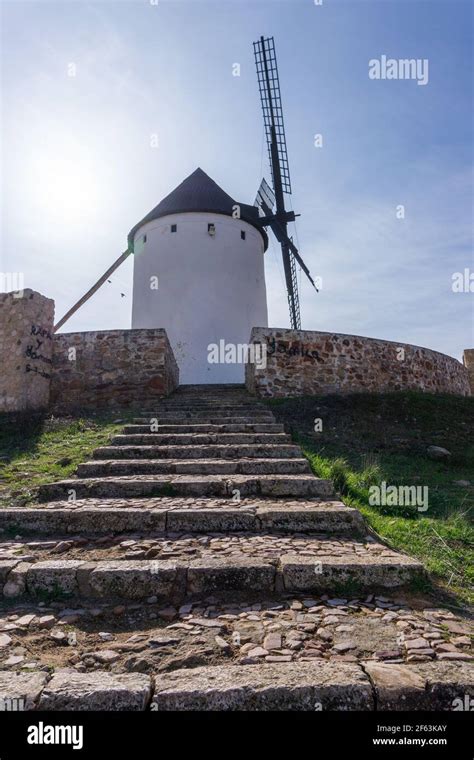 A whitewashed historic windmill typical of the La Mancha region of ...