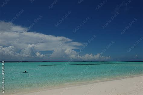 The clear ocean water and the scarse coral reefs of the Maldives Stock ...