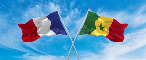 Crossed National Flags of France and Senegal Flag Waving in the Wind at ...