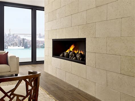 This devastatingly clean & modern limestone fireplace acts as the ...