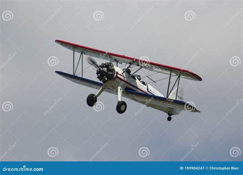 Red, White, and Blue Biplane Flying in the Sky Stock Image - Image of ...