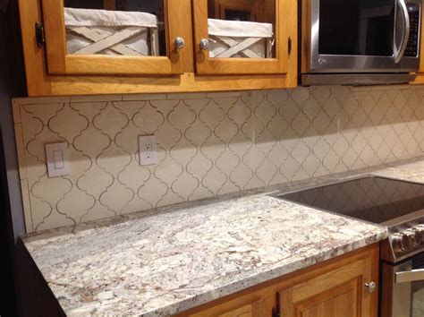 White Springs granite by Home Depot and Pratt & Larsen arabesque backsplash with a crackle ...