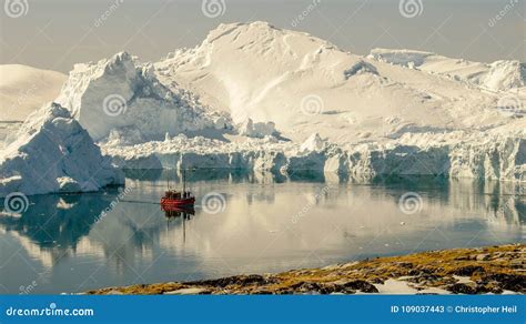 Boat Cruising between Icebergs in Greenland. Stock Image - Image of ...