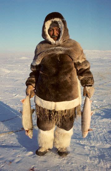 Nutarariaq, an Inuit hunter, with his catch of Arctic Char and Lake ...