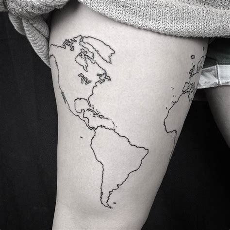 World map outline tattoo on the right thigh.