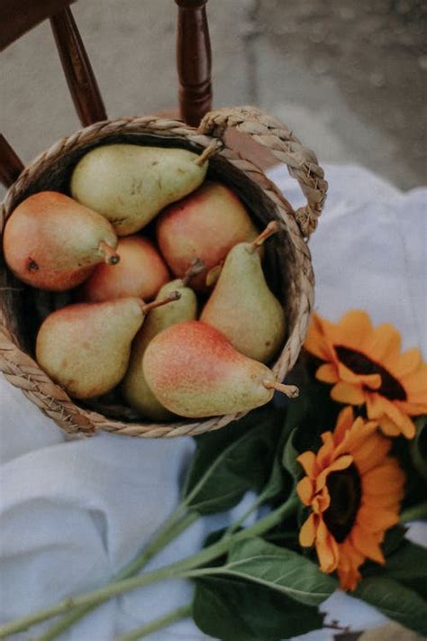 Red and Yellow Fruits on Brown Woven Basket · Free Stock Photo