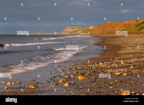 Whitby and its piers from Sandsend on the North Yorkshire Coast Stock Photo - Alamy