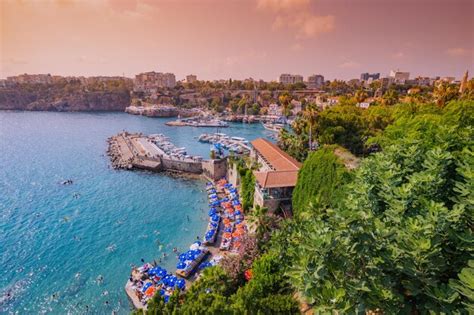 Premium Photo | 09 july 2022 antalya turkey mermerli beach and old town antalya port at sunset time