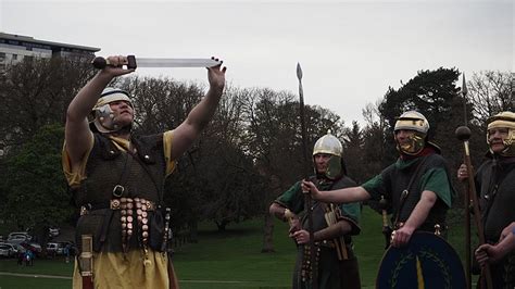 Image: Romans (Antonine Guard Living History Society) saluting at the Roman vs Picts 5k race ...