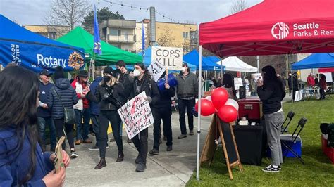 Ballard Commons park reopening event met with protests, lingering questions about future