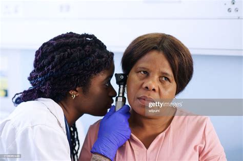 Otoscope Female Ear Examination Looking Closely High-Res Stock Photo - Getty Images