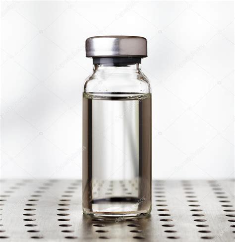 Medical vial of liquid in laboratory — Stock Photo © efired #46573309