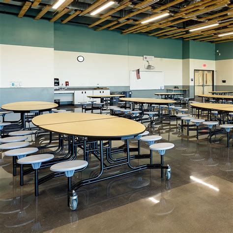 The cafeteria at Grand View Elementary features mobile NPS folding cafeteria tables for a ...