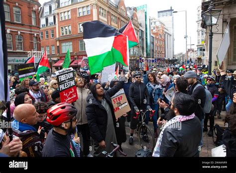 Pro-Palestinian protesters gather with flags and placards during a ...