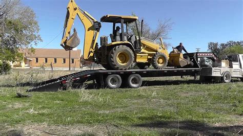 How To Load A Backhoe - YouTube