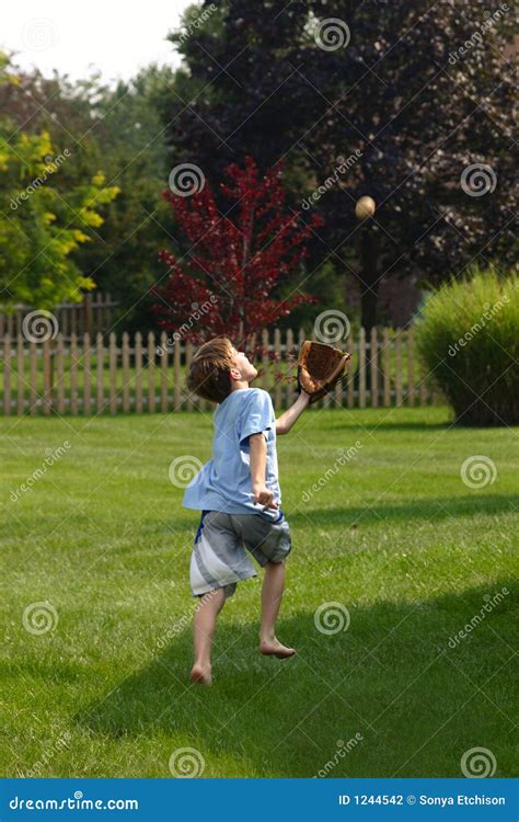 Boy Trying To Catch Ball Stock Photography - Image: 1244542