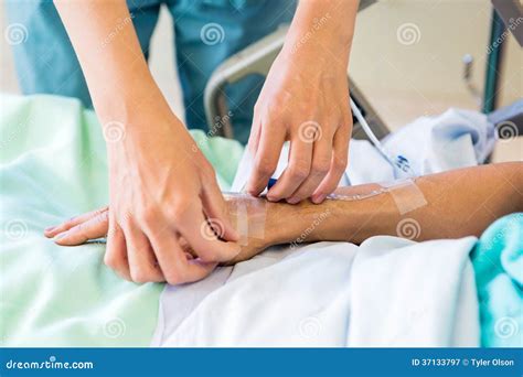 Nurse Starting An IV Line Royalty Free Stock Photography - Image: 37133797