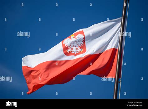 The state flag of Poland with the emblem of the Republic of Poland, on ...