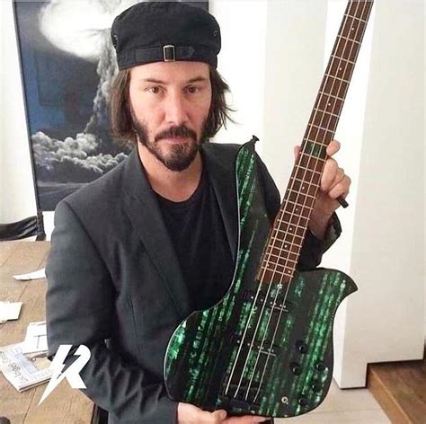 Keanu Reeves with his Matrix bass guitar (Credit- Rockifi on Instagram ...