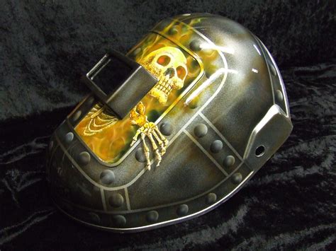 "Darkness" themed welding helmet airbrushed with riveted metal plates, realistic flames and ...